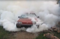 a red car with smoke coming out of it